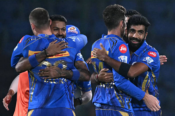 Mumbai Indians' players celebrate their win at the end of the Indian Premier League (IPL) Twenty20 cricket match between Delhi Capitals and Mumbai Indians at the Arun Jaitley Stadium in New Delhi