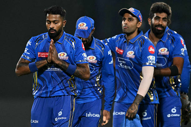 Mumbai Indians' captain Hardik Pandya (L) along with his teammates, walks back to the pavilion after their win at the end of the Indian Premier League (IPL) Twenty20 cricket match between Delhi Capitals and Mumbai Indians at the Arun Jaitley Stadium in New Delhi