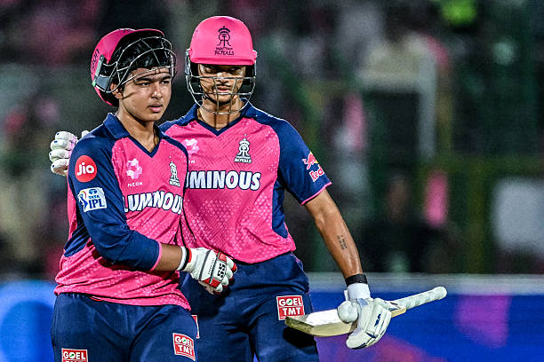 Rajasthan Royals' Vaibhav Suryavanshi (L) is being greeted by his teammate Yashasvi Jaiswal as he walks back to the pavilion after his dismissal during the Indian Premier League (IPL) Twenty20 cricket match between Rajasthan Royals and Gujarat Titans at the Sawai Mansingh Stadium in Jaipur 